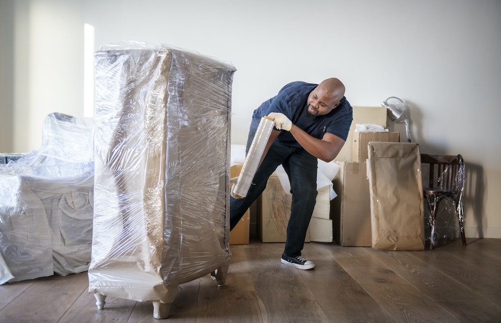 man moving furniture