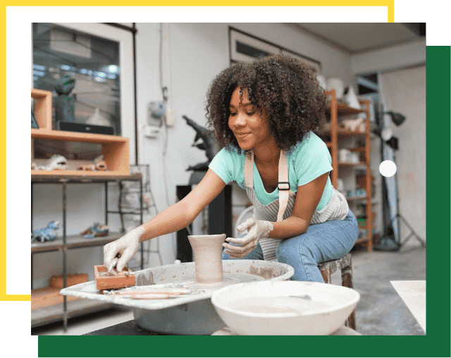 Young Woman hand potter making clay vase in pottery workshop, Business owner.