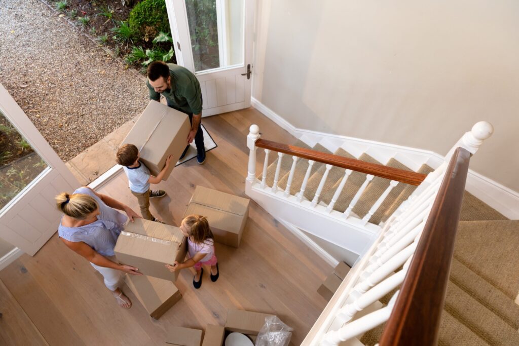 Family in new home with moving boxes